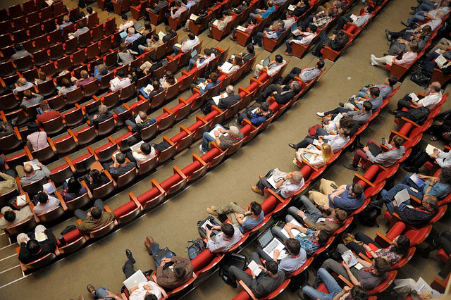 crowd sitting at an event 